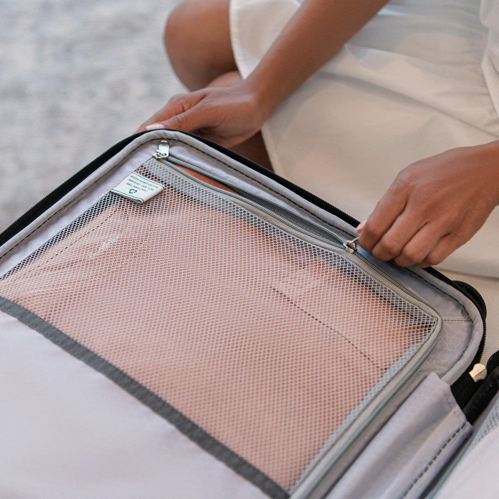 Luggage Repair, interior of suitcase opened and zipper being pulled